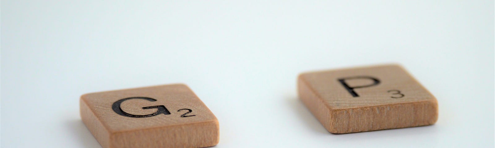 Two scrabble pieces, G and P, are placed a space apart to represent “market gap”