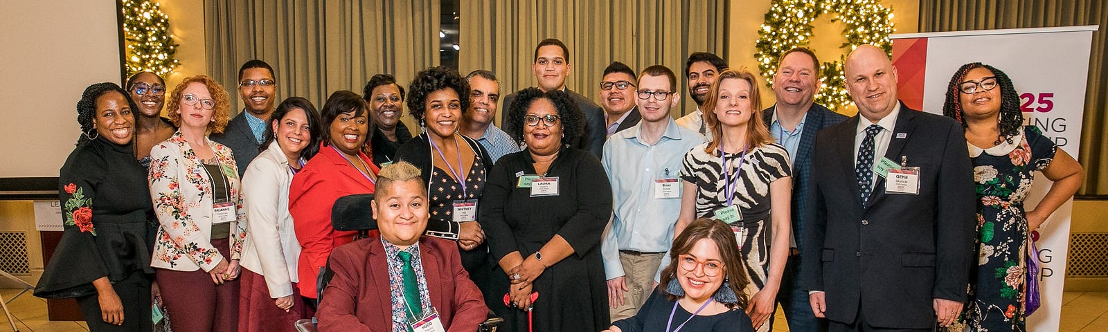 A group photo of about 20 people with visible and invisible disabilities pose with State Senator Robert Peters.