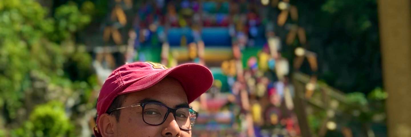 Picture of author with the backdrop of Batu Caves