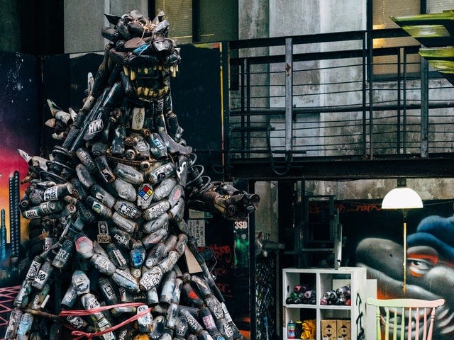 A Godzilla-type garage monster made out of empty cans and other metal.