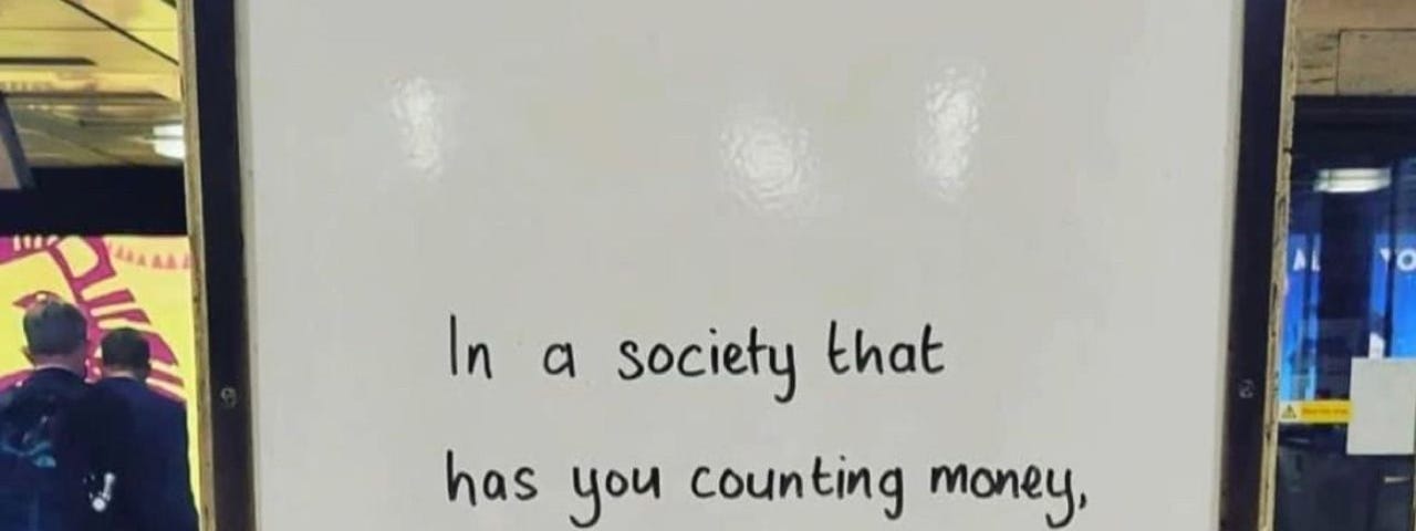 Sign saying “In a society that has you counting money, pounds, calories and steps, be a rebel and count your blessings instead.”