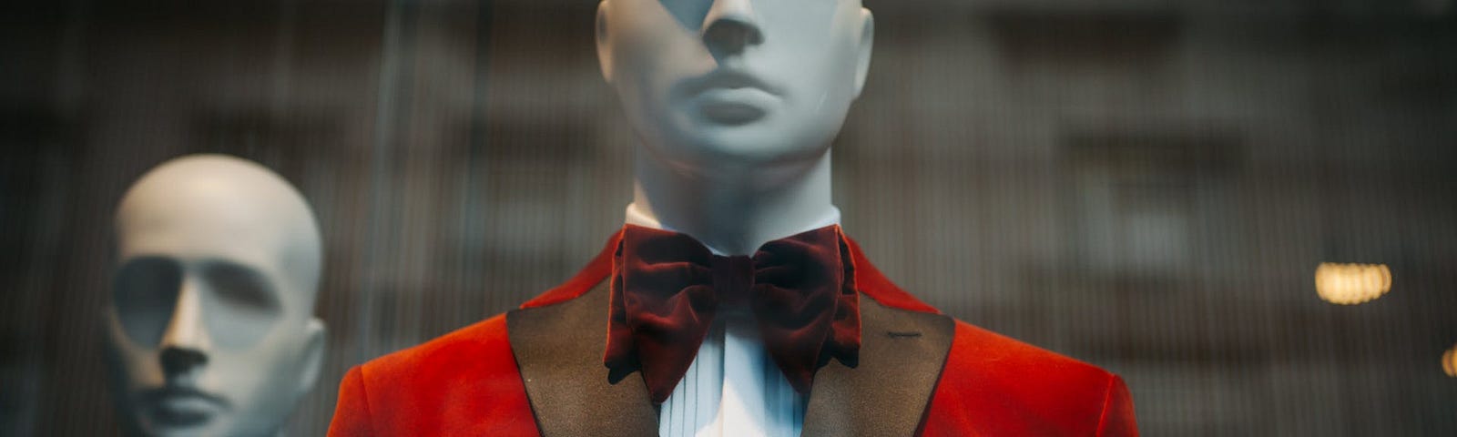 male mannequin in red tuxedo and tie