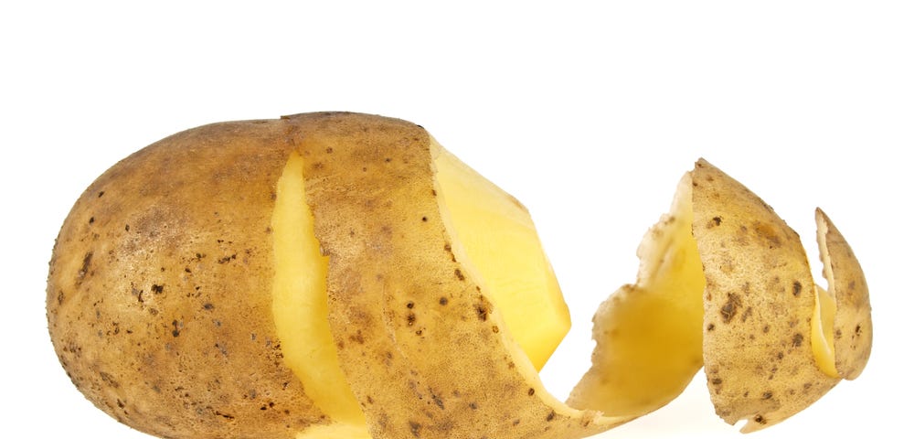 Picture of a potato with a partly loose peel