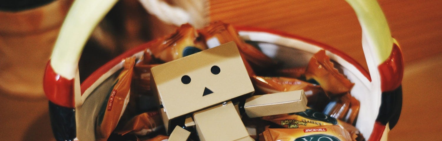 Cardboard toy in a bowl of candies