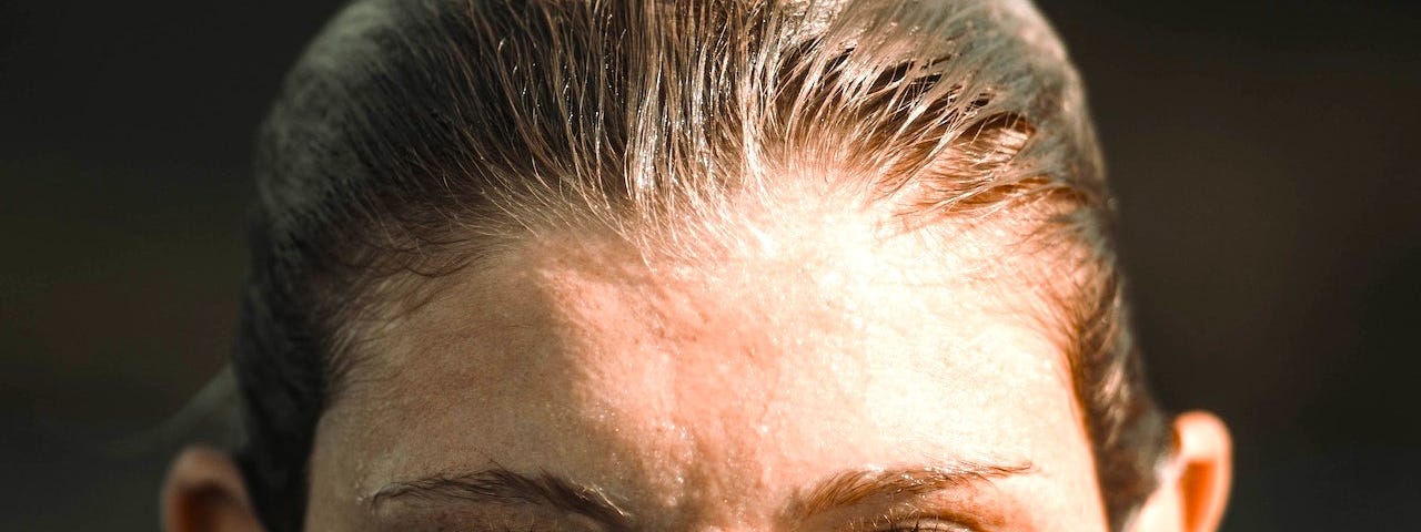 portrait of a woman half submerged in sea water