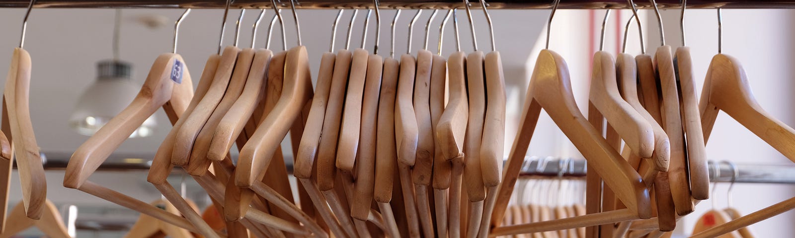 Wooden Hangers on Metal Rack