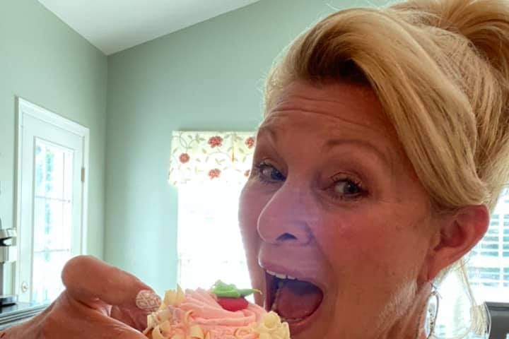 Me about to take a bite of a beautiful cupcake.