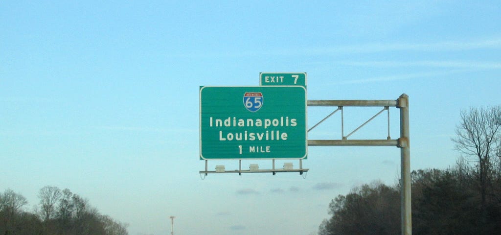 Exit sign showing Indianapolis and Louisville.