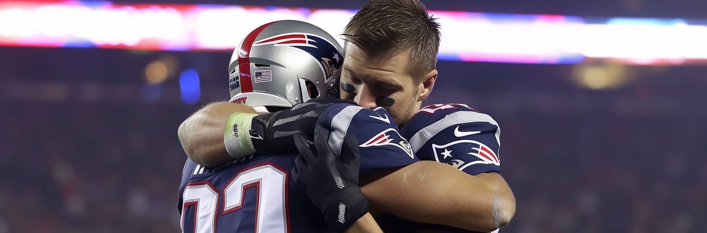 Two football players hugging