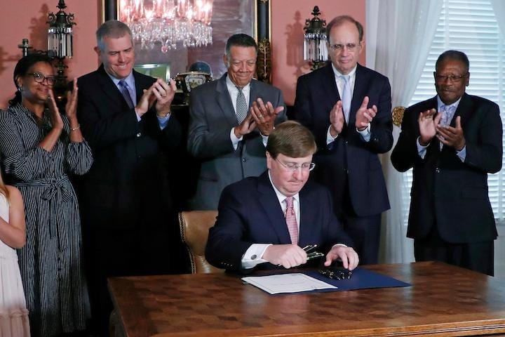 Governor Tate Reeves of Mississippi signing a new “Anti-Ejaculation Bill” into law. Humor, Satire, Funny, Sex. Abortion. Anti-Abortion.