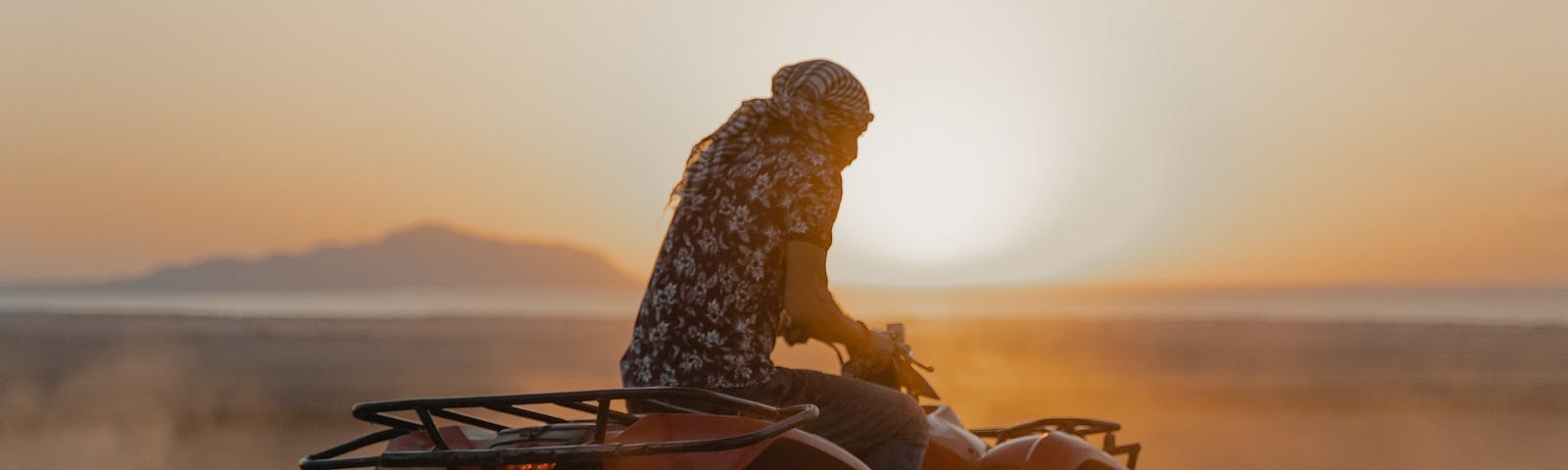 Man riding the ATV on brown sand | Why Most Writers Fail | Why writers fail, how to be a good writer, how to stop quitting, how to keep writing, writing, writing tips, medium, Tijjani Jibril
