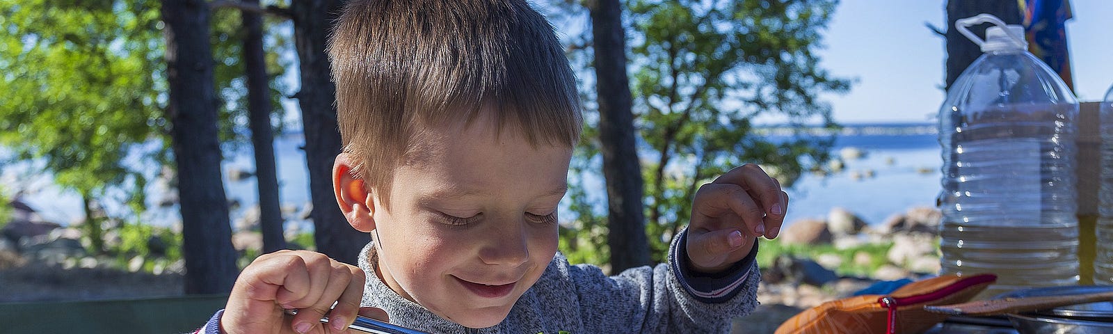 A kid eating a salad.