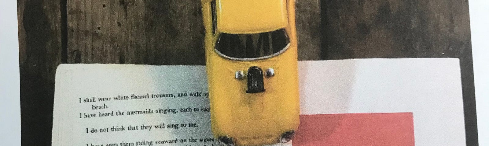 Shadowbox with yellow toy taxi, Miami Florida sign, and a page of poetry.