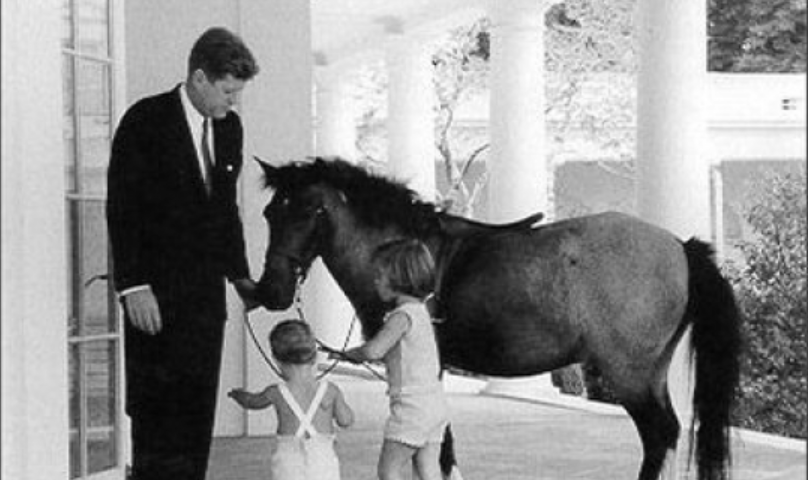 President Kennedy w/ Caroline and John on Colonnade of White House w/ Macaroni the pony