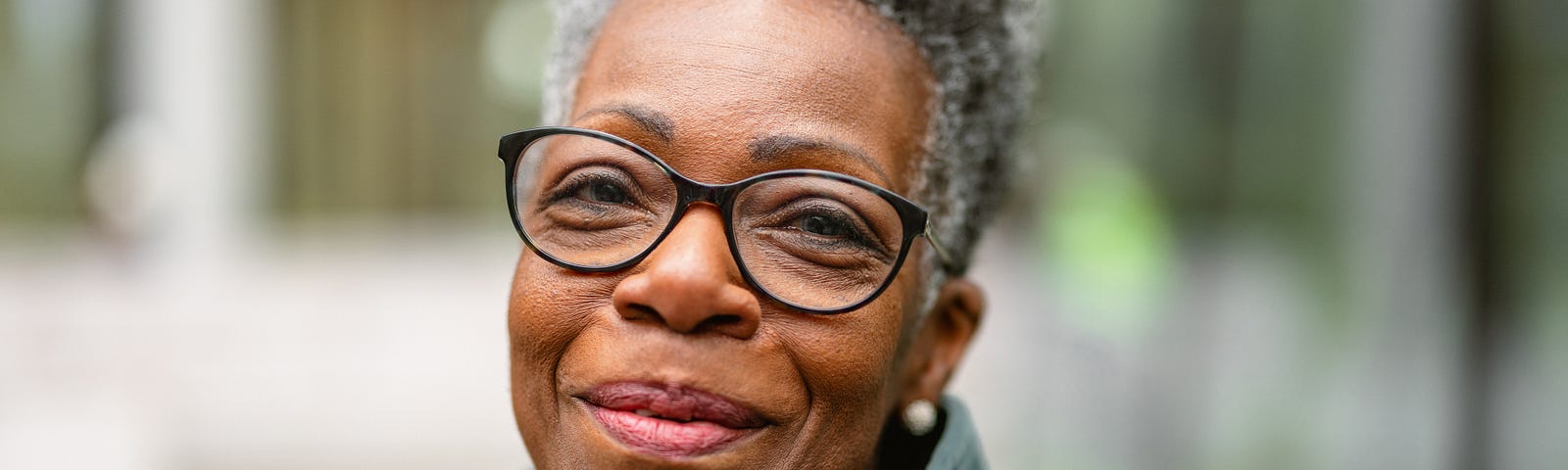 Portrait of a senior black woman smiling.