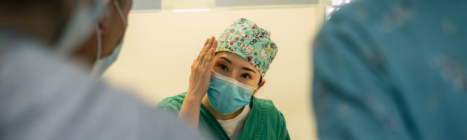 picture of doctor in scrubs and mask