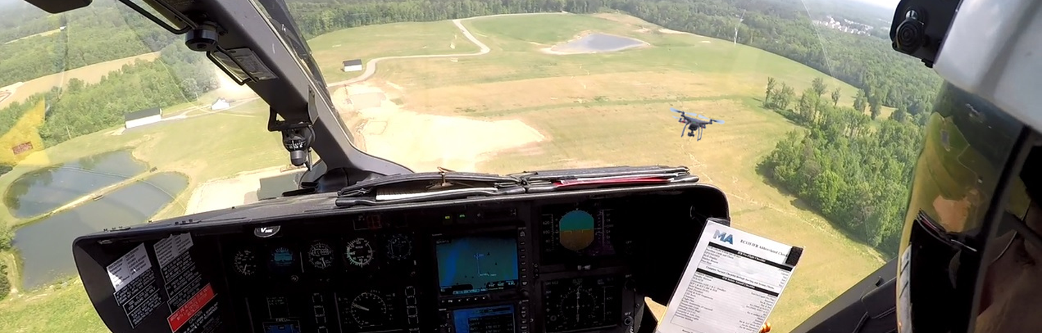 Photo illustration of drone seen from helicopter.