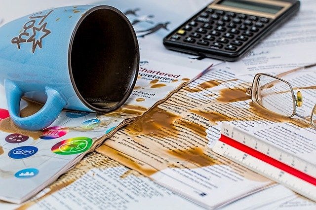 Coffee spilled over documents