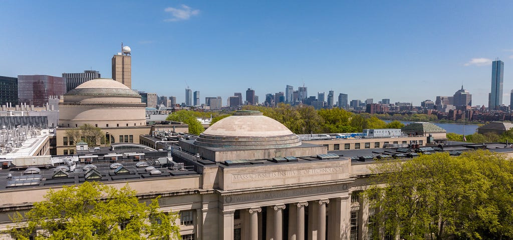 Aerial photo of MIT’s Great Dome with MIT campus in the background.