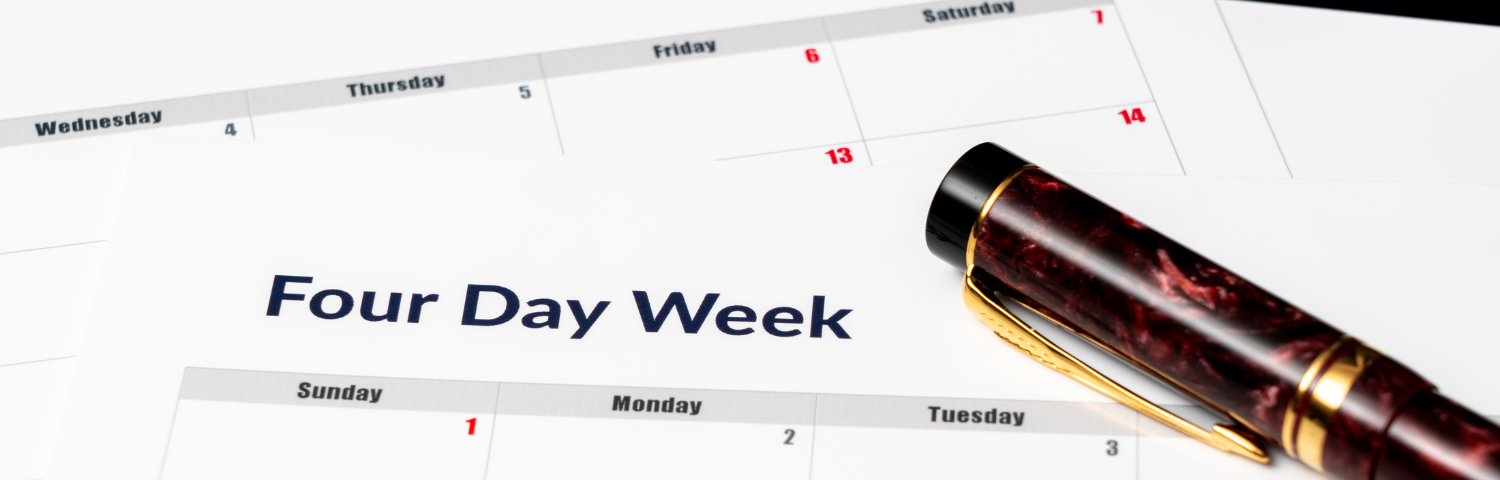 A red marbled pen sits on top of a calendar with the heading “Four Day Week.”