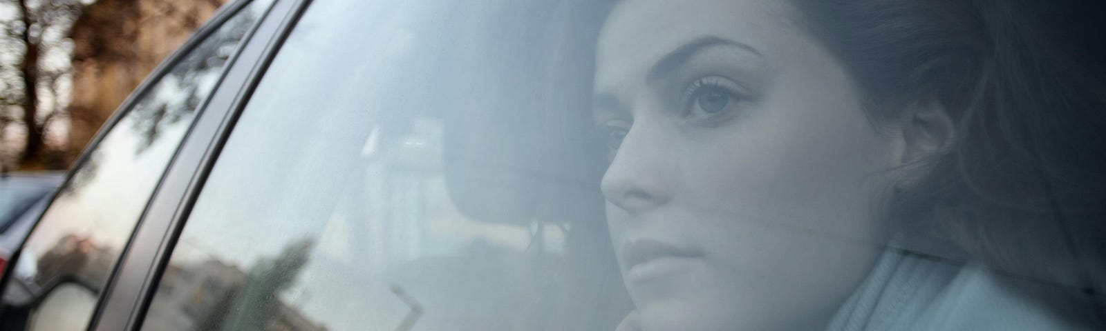 Woman Looking Out the Car Window