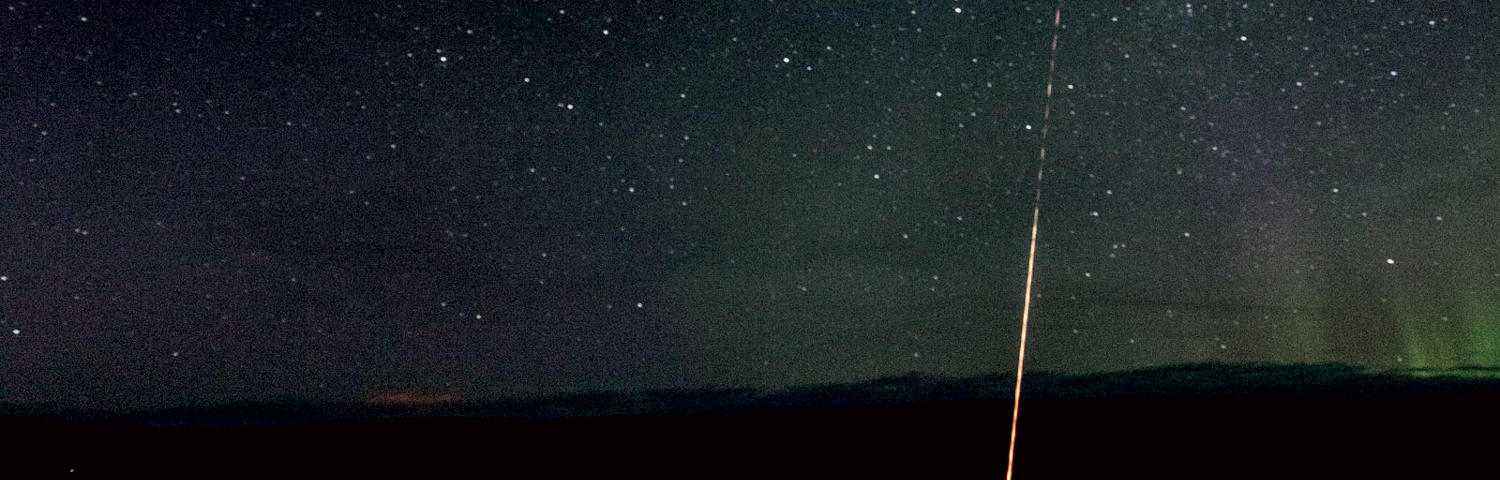 Rocket launch at night.