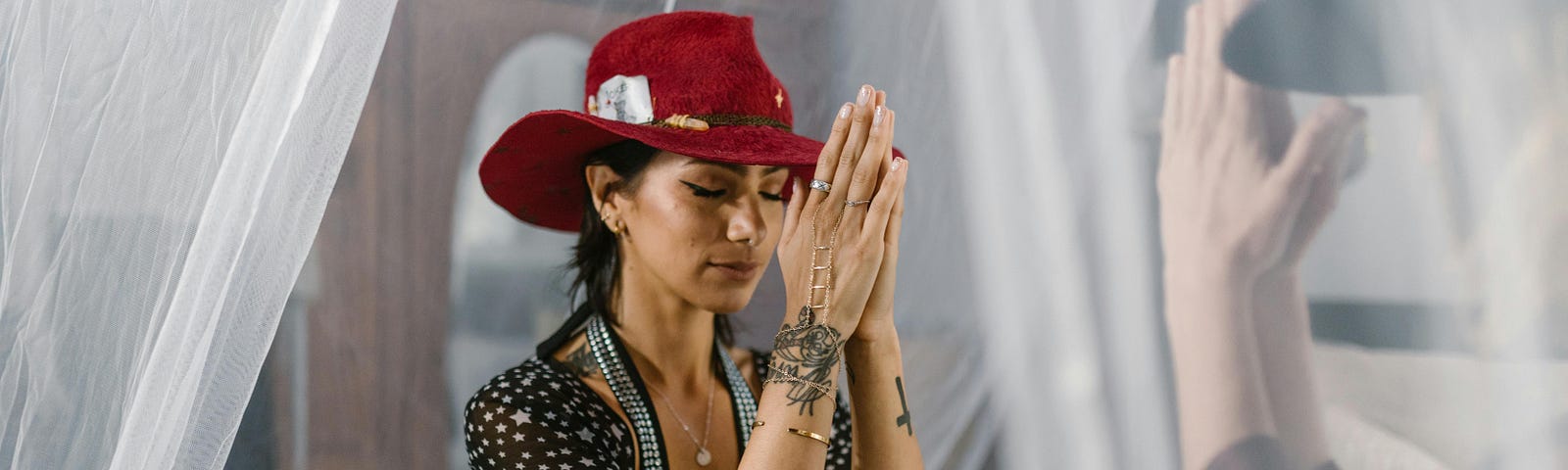 A woman engages in a spiritual ritual practice and prays