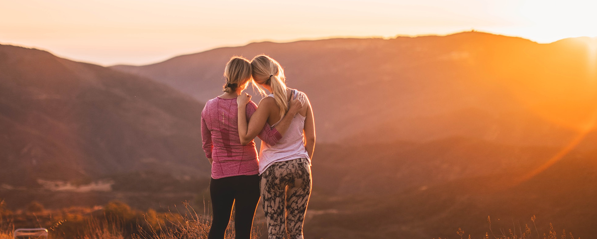 Mother and daughter watching the sunset