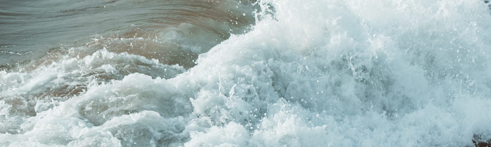 Waves crashing across the ocean surface