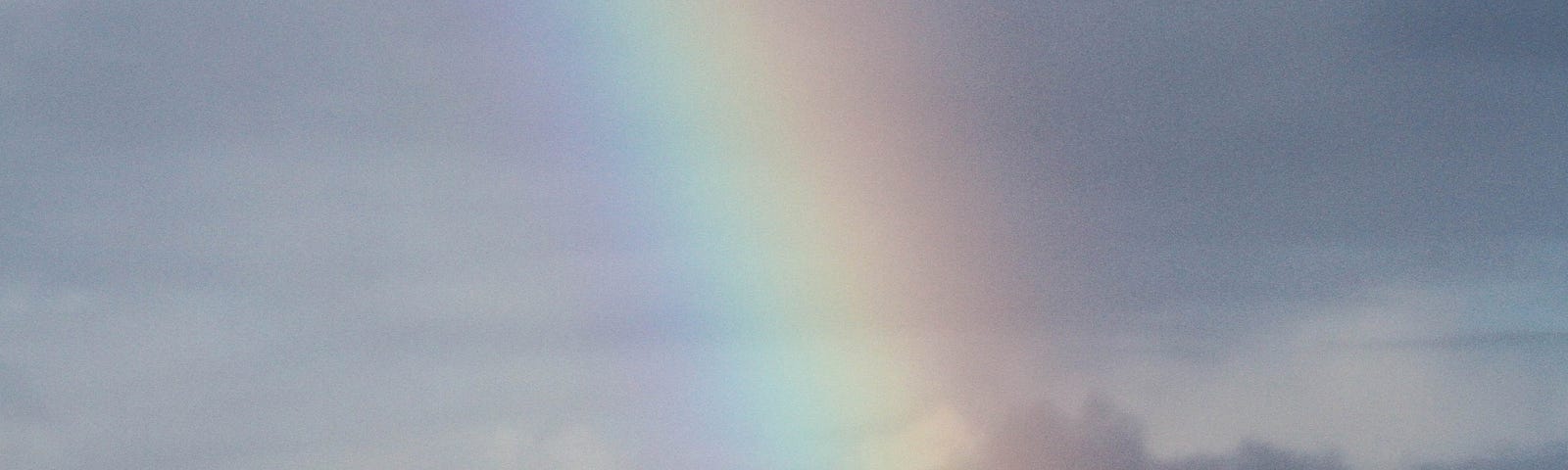 view of the ocen and sky, and a rainbow