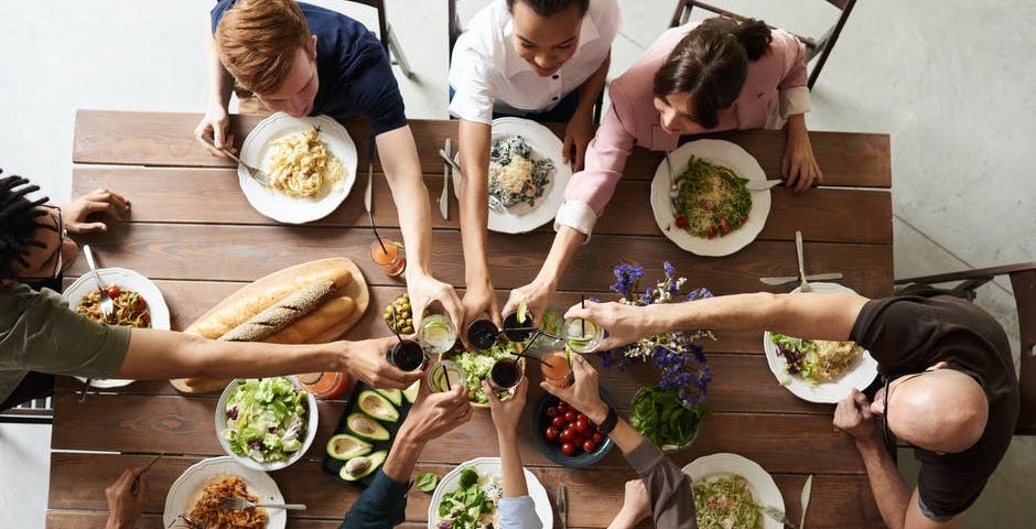 Group of people eating together