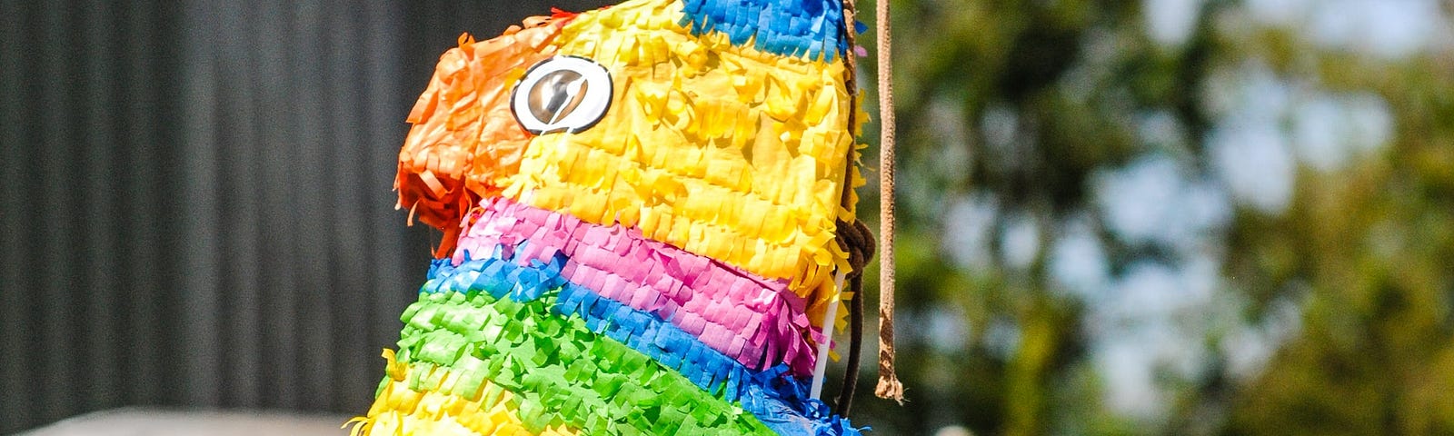 a rainbow colored horse piñata.