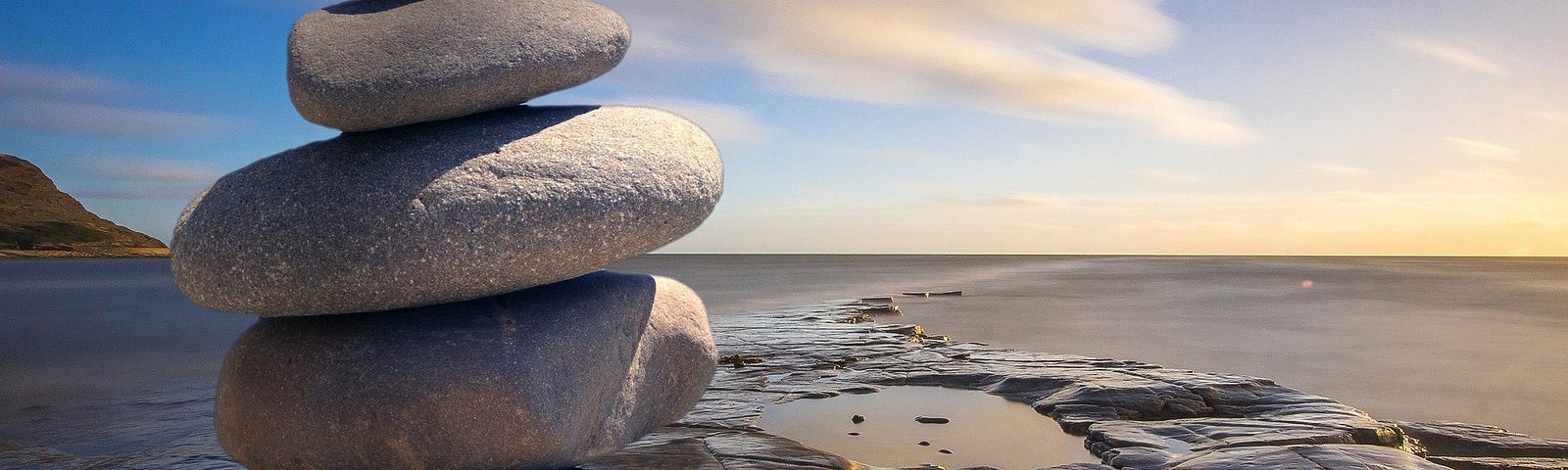 5 stones stacked on top of each other as Zen stones.