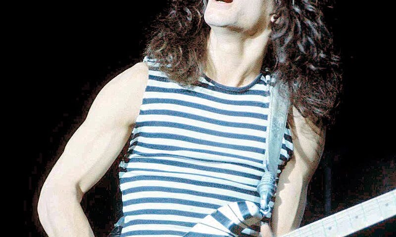 Eddie Van Halen plays guitar onstage