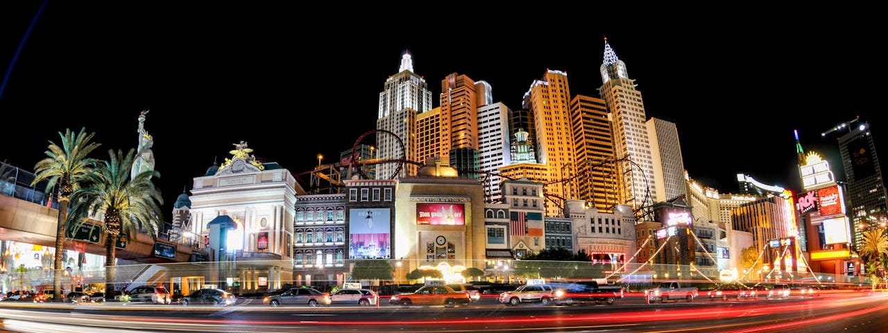Street view of the New York New York casino in Las Vegas at night.