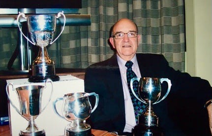 Bryan Stevens with a few of his trophies