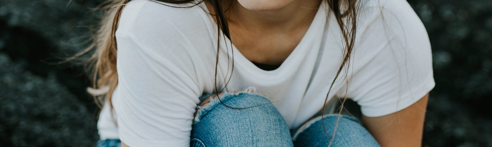 Young woman sitting and thinking