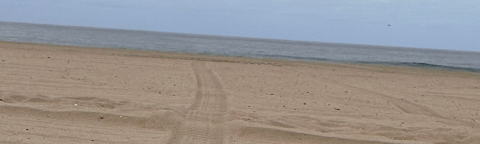 Football on the beach. Photo by Mark Tulin