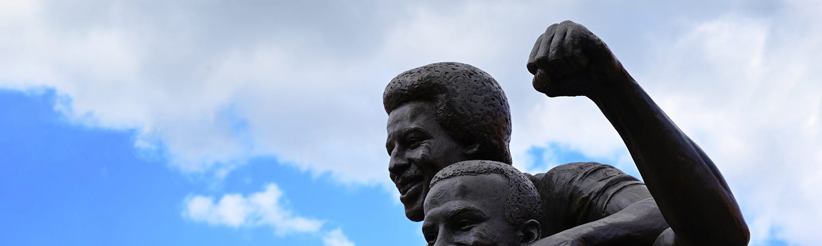 Sculpture of 3 Football players.