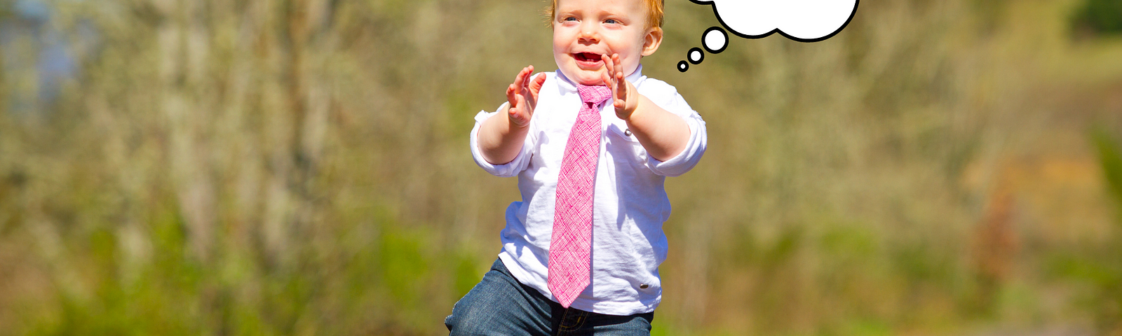 Image of a toddler walking on pavement wearing a pinkish-red necktie, dress shirt, and pants. A thought bubble above the baby’s head contains text reading, “This is a clip-on… my dad has failed me.”
