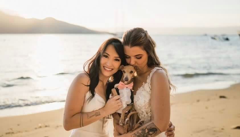 Lua with her wife and dog at their wedding