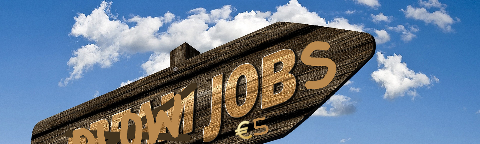 Image of a sign pointing toward the top right corner, with a clear blue sky in the background. The original image wrote ‘Dream Job’ but it was processed to ‘Blow Jobs / €5’.