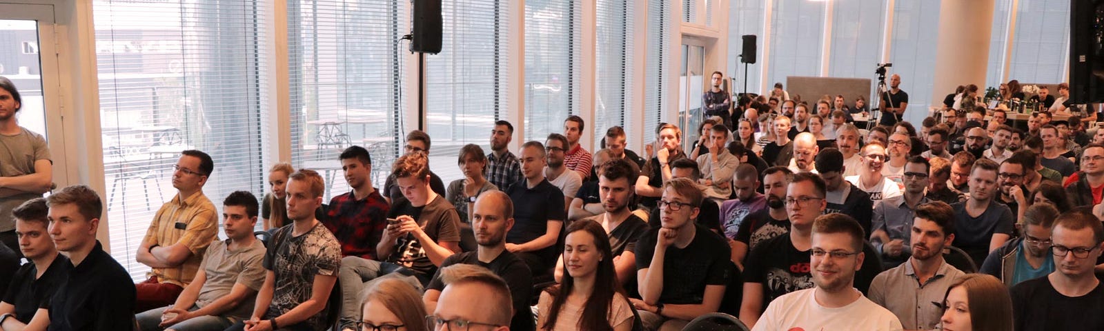 Photo from WarsawJS Meetup presents a crowded space at Warsaw Spire
