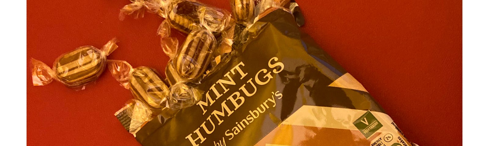 Picture of an opened packet of mint humbug sweets