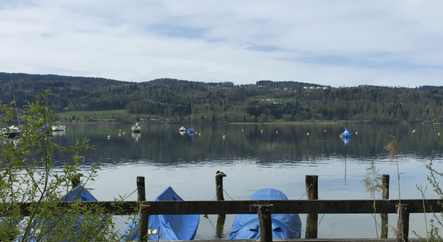 Small boats moored along a quiet lake — Moral Letters to Lucilius