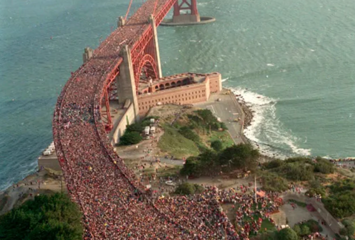 A massive crowd is on the Golden Gate bridge in San Francisco.