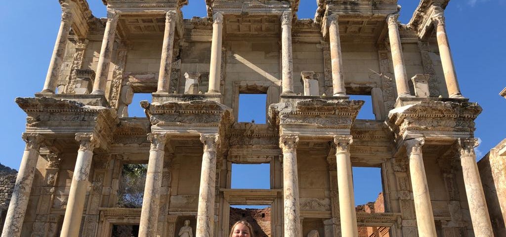 My daughter stands in front of the ruined library in Izmir, Turkey.