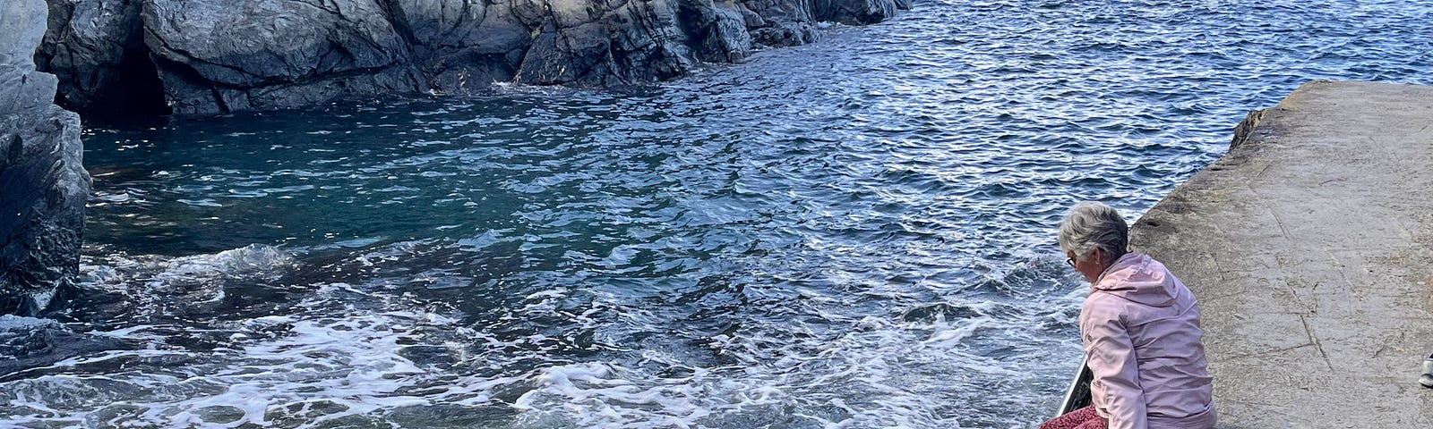 Author’s toes in the water via a boat ramp adjacent to the Ligurian Sea, Manarola, Italy.
