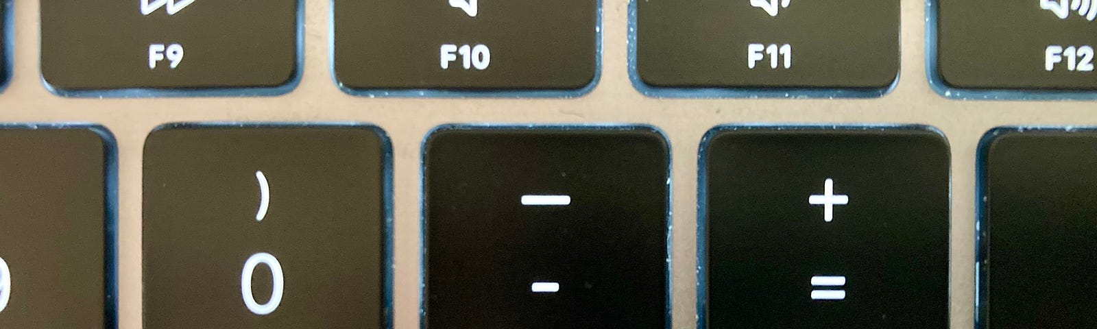 Closeup of a Mac keyboard, emphasising the hyphen key