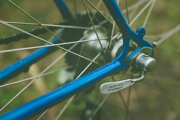 Bike wheel showing handle to adjust tension